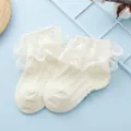 Close-up of baby lace socks in cream white with double-layered ruffles and hollow textures - White / 9-12cm(6-12 Months)