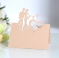 Detail of laser-cut place card featuring groom bride silhouette and Mr & Mrs heart - Jade Pearl