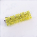 Detail of five translucent yellow resin bears on a silver metal alligator hair clip - Yellow