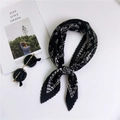 Pleated black and white silk scarf for women styled with sunglasses on a white surface - 2 Pleated Polka Dot Paisley Black