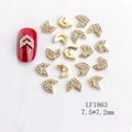 Macro view of V-shaped alloy nail charms with rhinestones and gold finish - Gold White Rhinestone V-shape Style (1863)