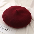 Macro detail of wine red wool beret showing premium knitted texture and classic stem top - One Size / Burgundy