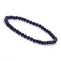 Macro detail of deep blue blue sand stone beaded bracelet with sparkling star effects - Blue Sandstone