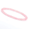 Close-up of 6mm pink quartz natural stone beaded bracelet on white background - Rose Quartz