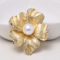 Elegant gold flower brooch featuring a large white faux pearl and sparkling rhinestones - 0468-Gold Flower Rhinestone Pearl