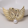 Elegant gold finish matte double swan brooch featuring a white pearl and black stone eye - 0473-Gold Swan Pearl