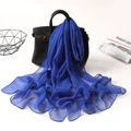 Elegant blue georgette long scarf draped on a black handbag for a stylish fashion look - Sapphire Blue