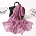 Detail of purple chiffon scarf draped on handbag with elegant lightweight texture - Dust Rose