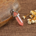 Pink quartz hexagonal pendant necklace with silver clasp on natural rustic background - Watermelon Red