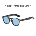 Gafas de sol retro con montura negra, lentes azul claro y remaches de flecha plateados - Montura Negra Lentes Azules