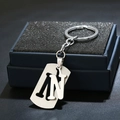 Detailed close-up of silver brushed metal keychain with 3D letter N on dark blue velvet box - Letter N