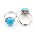 Detail of adjustable silver ring featuring a blue turquoise-style bead on white background - Adjustable Open / Synthetic Blue Turquoise