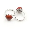 Close-up of adjustable silver rings with round tiger eye and red jasper stone insets - Adjustable Open / Red Jasper