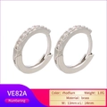 Macro shot of 13mm rhodium plated brass hoop earrings with micro pavé crystal inlay - Platinum White Zirconia