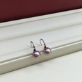 Elegant silver hooks with pink-purple freshwater pearls showing a natural luster - 7.5mm Silver Base Purple Button Pearl Silver High Heel
