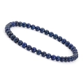 Detailed view of 4mm navy blue natural stone beads strung on an elastic bracelet - Lapis Lazuli