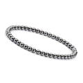 Macro detail of 4mm dark grey metallic natural stone beaded bracelet on white background - Hematite