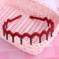 Red wavy fabric wrapped headband with inner teeth for women in pink basket - Protective Cover Style / Wine Red Solid