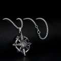 Silver compass pendant necklace with star motif on black textured background - Octagonal Star Compass Style (A160)