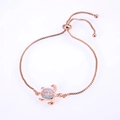 Detail of rose gold sea turtle bracelet with opal inlay and zircon stones on snake chain - Pink Double Turtle / Rose Gold