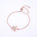 Rose gold turtle bracelet with white opal inlay and zircon stones on white background - Rose Gold Plated White Opal Turtle Bracelet