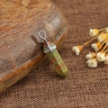 Natural green and red quartz crystal hexagonal pillar pendant on smooth brown stone - Unakite