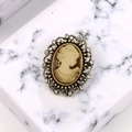 Vintage bronze cameo brooch with beige relief and sparkling rhinestones on marble - Coffee Antique Bronze
