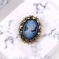 Vintage cameo brooch with blue lady profile relief and gold alloy frame with tiny rhinestones - Blue