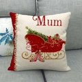 Linen Christmas pillow cover with red sleigh design and Mum text on grey sofa - Style 6