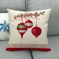Christmas linen pillowcase with red and green bauble prints on a modern sofa - Style 4