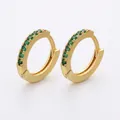 Macro view of gold-plated brass huggie earrings with pave emerald green crystals, 13x14mm size - Gold Green Zirconia