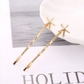 Juego de dos horquillas doradas con forma de estrella de mar para mujer con diseño oceánico - Par de Estrella de Mar