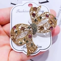 Elegant gold-tone bow brooch with multi-colored crystals and intricate wire filigree - G4 Bowknot