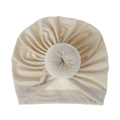 Macro shot of cream baby donut turban hat with pleated knit fabric and central knot detail - One Size / Beige