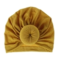 Close-up of a mustard yellow knit cotton baby turban hat featuring a donut knot detail - One Size / Turmeric