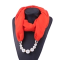 Detail of red chiffon scarf with integrated pearl pendant necklace on a black mannequin - 180*70cm / Orange Red