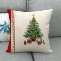 Linen Christmas pillow case featuring a decorated tree and gift boxes on a grey sofa - Style 1