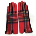 Detail of red Scottish tartan wool gloves featuring side slits and black palm fabric - One Size / Red