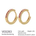 Detail view of gold-plated brass hoop earrings with pink zircons measuring 13mm by 14mm - Gold Red Zirconia