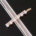 Detail of white pearls set on a gold metal hairpin base over a black reflective surface - Mixed Sizes Pearl Alloy Bobby Pin