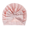Close-up of pink baby turban hat featuring a large layered bow and elastic knit fabric - Pink