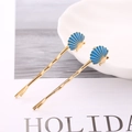 Chic gold wave hair clips with blue seashell charms for a stylish marine look - Blue Enamel Shell Pair