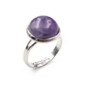 Close-up of a purple cabochon crystal ring with an adjustable silver-tone band - Adjustable Open / Purple Crystal