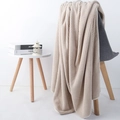 Absorbent beige waffle knit bath towel draped over a grey armchair in a home setting - Pineapple Grid Deep Coffee
