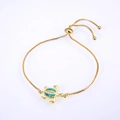 Close-up of golden turtle bracelet with green opal inlay and sliding adjustable clasp - Gold Plated Green Opal Turtle Bracelet