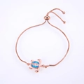 Macro view of adjustable rose gold turtle bracelet with blue opal and zircon detail - Rose Gold Plated Blue Opal Turtle Bracelet
