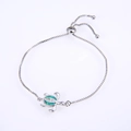 Detail of silver turtle bracelet with green opal inlay and adjustable sliding clasp closure - White Gold Plated Green Opal Turtle Bracelet