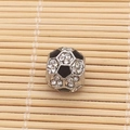 Macro shot of silver soccer charm bead with black enamel and sparkling rhinestones - Soccer with Rhinestones