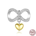 925 sterling silver bow charm bead with sparkling white zircons and golden heart pendant - SCC1300 Bow Heart