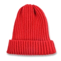 Detail of red knit beanie featuring classic ribbed texture and folded cuff design - Red